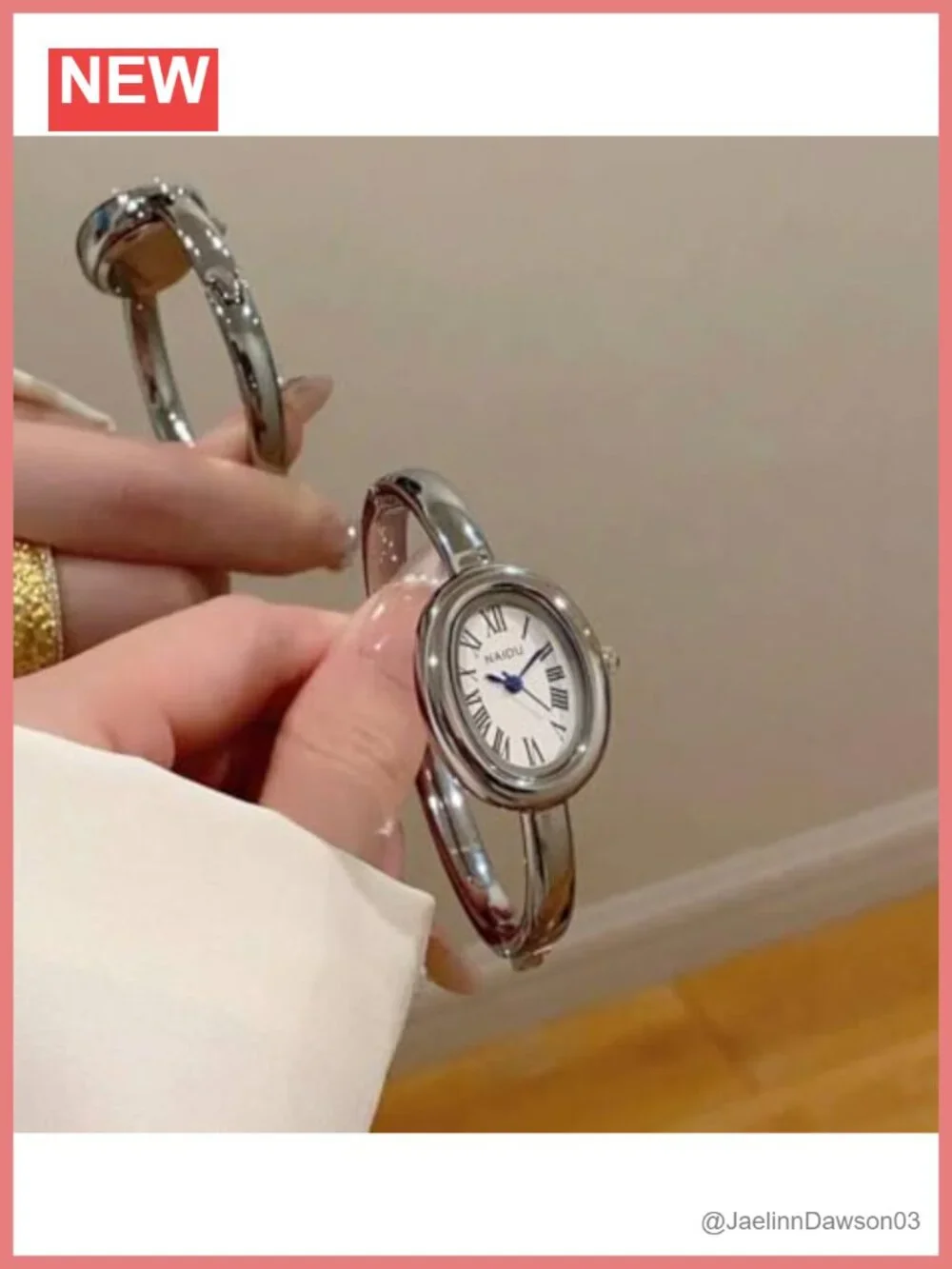 Elegant Gold-Tone Stainless Steel Bangle Watch with Oval Roman Numeral Dial
